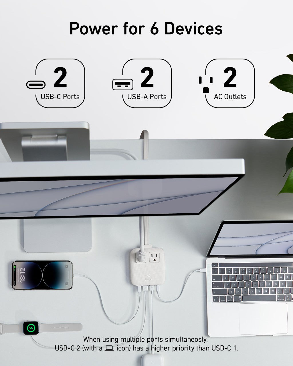Anker charging station powering six devices with USB and AC ports